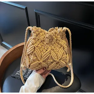 Detail of hand-woven crochet bucket bag with geometric patterns and wooden beads