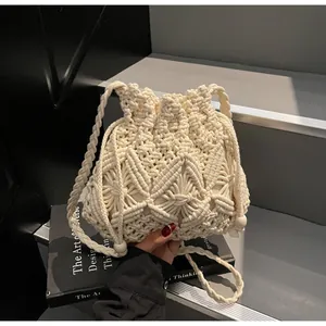 Detail of macramé woven bucket bag with elegant wooden beads and boho pattern texture