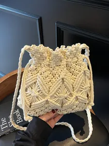 Handmade macrame crochet bucket bag in beige with leaf pattern for beach vacation