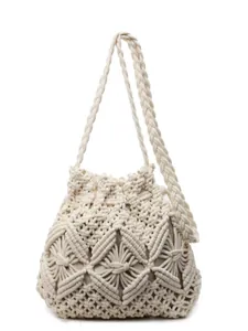 Beige crochet bucket bag with hollow geometric pattern and matching woven shoulder strap