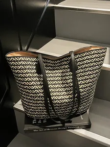French style woven tote bag with black and white geometric patterns for beach and commute