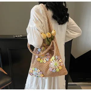 Detail of hand-woven hollow knit tote bag featuring vibrant 3D colorful floral patterns