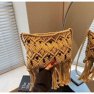Detailed macro view of bohemian hand-woven crochet bag with wood beads and long tassels