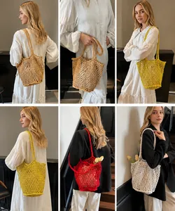 Detail view of colorful crochet tote bags in four colors showing honeycomb hollow pattern