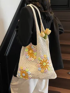Chic cream hollow-out crochet tote bag with colorful 3D floral patterns and sun motifs