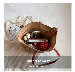 Interior view of large straw tote bag with zipper pocket and spacious compartments