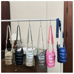Quilted puffer mini crossbody bags in six metallic colors shown hanging on a display rack