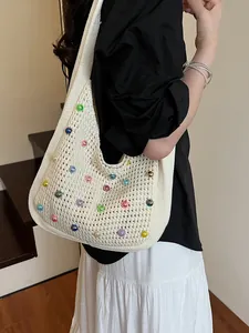 Bohemian off-white crochet shoulder bag with colorful beads for beach vacation style