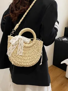 Borsa in paglia intrecciata a mano con fiocco di pizzo e tracolla da spiaggia