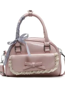 Chic pink bowling bag for women with lace trim and ribbon handle in a minimalist style