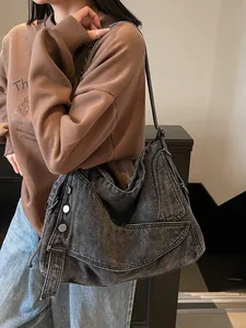 Large gray denim tote bag with wide strap, minimalist slouchy shoulder bag for commuting