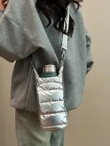 Silver quilted water bottle crossbody bag with adjustable strap for outdoor use