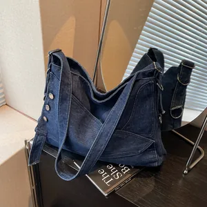 Deep blue denim large capacity tote bag with silver studs and wide shoulder strap
