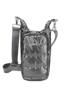 Metallic grey quilted puffer crossbody bag with silver zipper and nylon shoulder strap