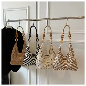 Detailed display of four handmade crochet tote bags with elegant wooden bead handles
