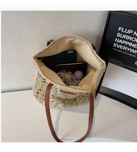Top view showing spacious interior and fabric lining of this woven straw beach tote bag