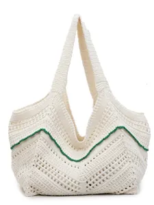 Minimalist white knit tote bag with green wavy trim for beach and summer travel