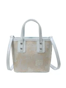 Light blue embroidered tote bag with vintage oriental pattern and leather handles