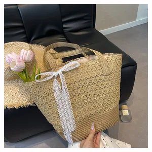 Detailed macro view of woven lace beach bag with white ribbon bow and tulip decoration
