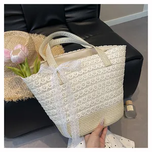 Close-up of intricate white lace layers and a bow on a woven summer beach tote bag