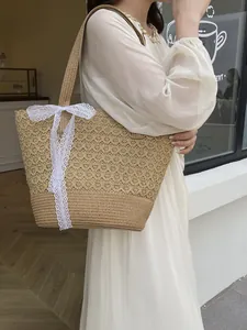 Handwoven straw tote bag with white lace ribbon and honeycomb hollow texture for summer