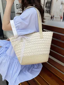 Lace woven tote bag with floral embroidery and bow detail for summer beach vacation