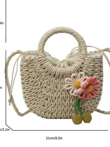 Handwoven semi-circle straw bag with 3D floral accents and drawstring lining