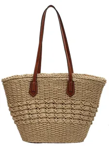 Summer woven straw tote bag with brown leather straps and hollow design for beach or commute