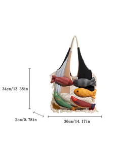 Bohemian knit tote bag with colorful 3D fish dolls and tassel details on white background