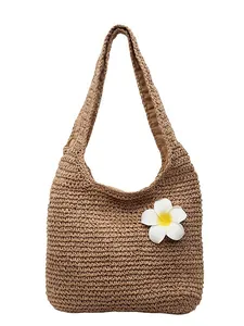 Handwoven straw tote bag with plumeria flower detail for beach vacation use