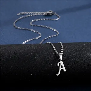 Polished silver stainless steel necklace with cursive letter A pendant on black display