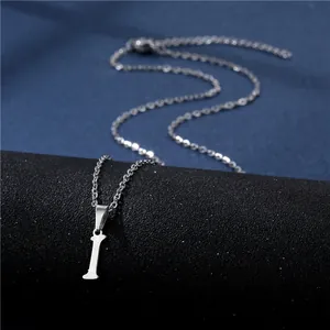 Close-up of polished stainless steel necklace featuring a lucky letter I pendant