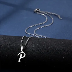 Macro shot of silver stainless steel necklace with artistic letter P pendant