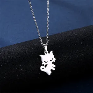 Macro shot of silver cat pendant necklace on black stand with glossy steel finish