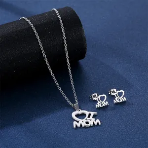 Silver I Love Mama necklace and earrings set on a textured deep blue background