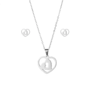 Polished stainless steel jewelry set featuring heart lock pendant necklace and stud earrings