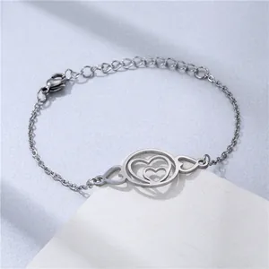 Silver stainless steel heart bracelet with interlocking double hearts and adjustable chain