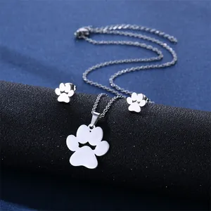 Minimalist silver cat paw jewelry set with crown cutout necklace and matching stud earrings