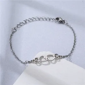 Polished stainless steel double heart charm bracelet with adjustable chain on stone