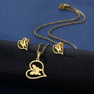 Golden stainless steel necklace and earrings set featuring hollow heart and butterfly charms