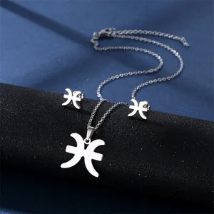 Silver Pisces constellation zodiac necklace and stud earrings set on dark blue background