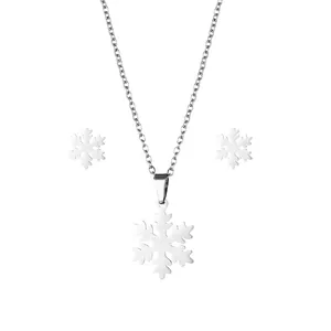 Silver snowflake necklace and stud earrings set in polished stainless steel