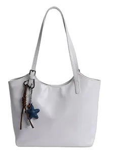 Minimalist white faux leather tote bag with star charm and long shoulder straps