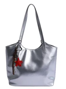 Metallic silver tote bag for women with decorative star and heart charms for commute