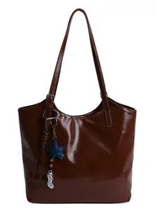 Chic dark brown glossy leather tote bag with star and peanut charms for daily commute