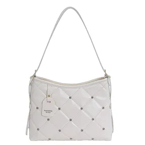 Fashionable white quilted faux leather shoulder bag with rhinestones and a chain strap
