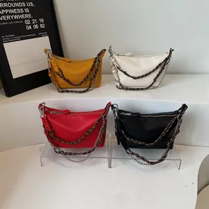 Detailed display of crescent shoulder bags in four colors with braided chain straps