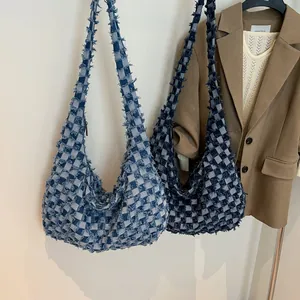 Denim checkered hobo bag with fringe edge details in light and dark blue styles