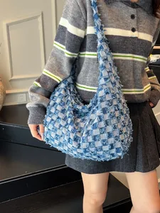 Retro denim tote bag with blue checkerboard fringe pattern and wide shoulder strap