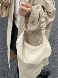 Beige pleated shoulder bag with a cloud-shaped design and ruched strap for women